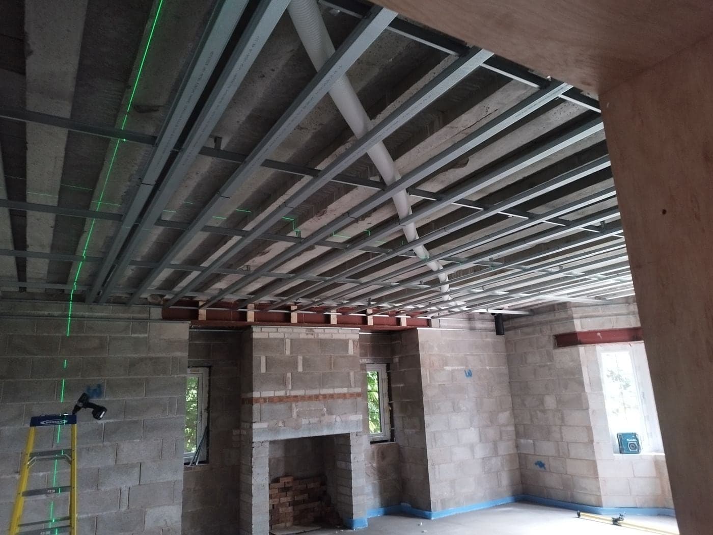 MF ceiling metalwork and channels set out level in Prestbury, Cheshire