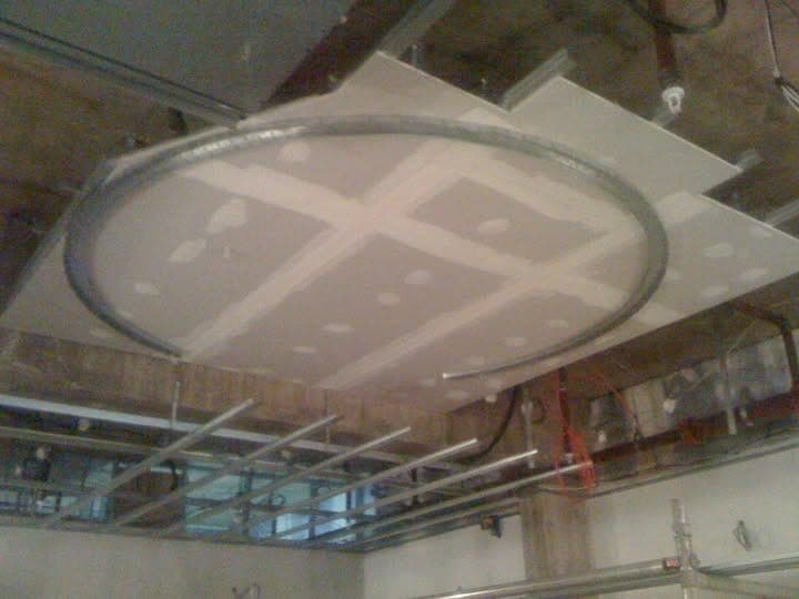 Circular MF ceiling drum boarded in plasterboard on a metal ring frame at the Thomas Sabo store, Milton Keynes